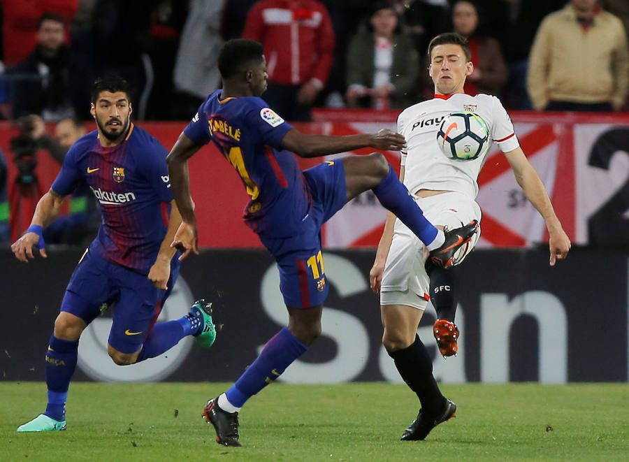 El líder salvó un punto en su visita al Sánchez Pizjuán (2-2) al neutralizar con tantos de Luis Suárez y Messi los goles de Franco Vázquez y Muriel.