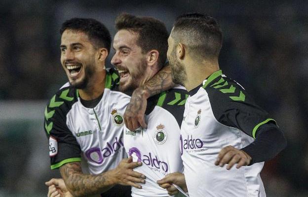 Tres andaluces. Hidalgo (izquierda) Rafa de Vicente y Cejudo celebran un gol. :: daniel pedriza