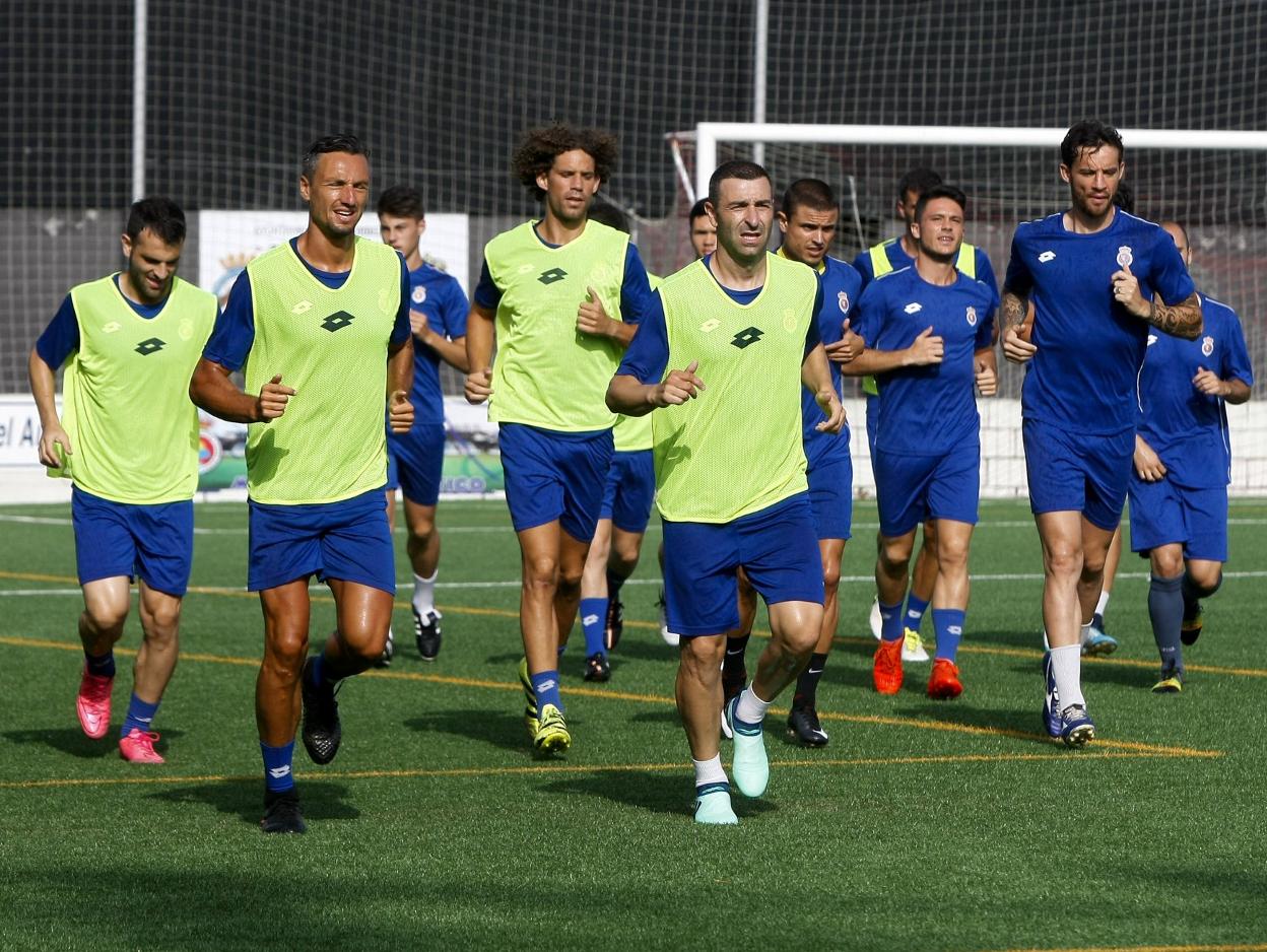 Los jugadores Cusi, Luis Alberto y Nacho Rodríguez.