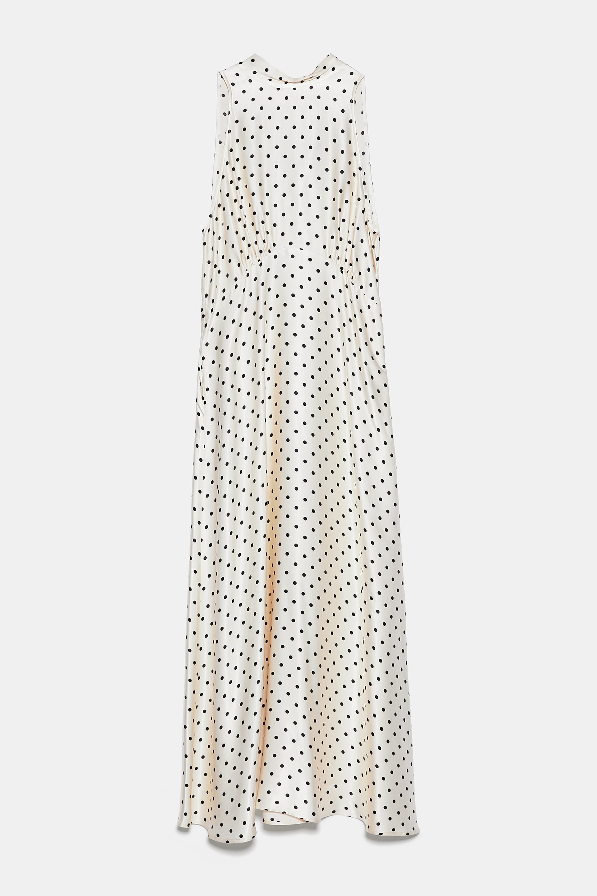 Vestido de lunares con cuello halter, de Zara (39,95 euros).