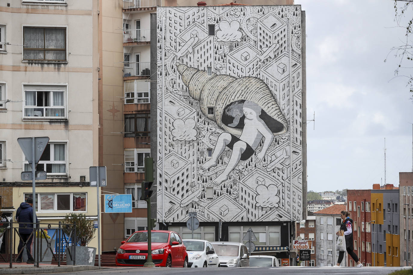 Las obras de este reconocido artista callejero de origen italiano conocido como 'Millo' muestran personajes que exploran su configuración urbana. Suele recurrir a líneas simples en blanco y negro introduciendo notas puntuales de color. Esta actuación de la calle Universidad se realizó en 2023.