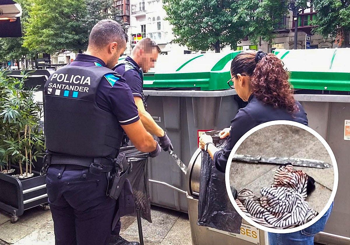 La Policia Local de Santander retira el machete de un contenedor.