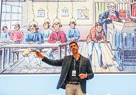 Jorge Calvo, investigador en IA, con una de las diapositivas de fondo que le han servido para ilustrar el impacto de la inteligencia artificial en la educación.
