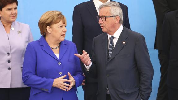 Angela Merkel y Jean-Claude-Juncker. 