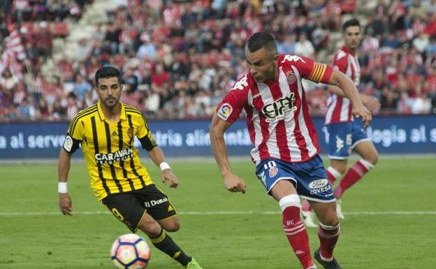 El jugador del Girona Eloy Amagat (d). 