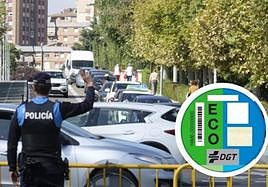 Imagen de archivo de vehículos en Valladolid. En el círculo, el distintivo de la DGT.