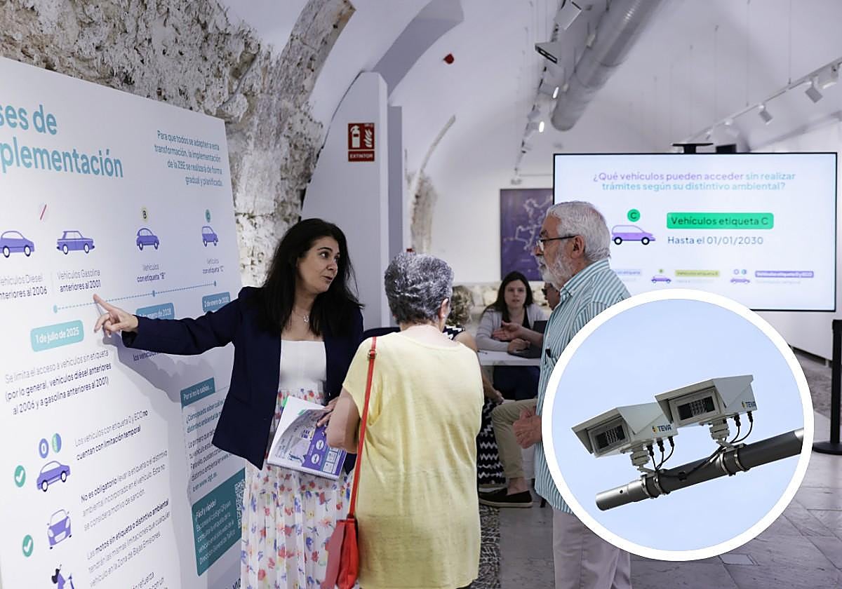Una pareja pregunta sobre la zona de bajas emisiones en la exposición informativa que acoge la sala de San Benito.
