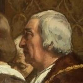 El hombre de pelo canoso en la última fila, a los pies de la cama.