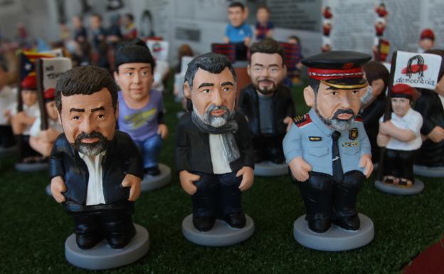 Figuras de Trapero y los 'Jordis'.