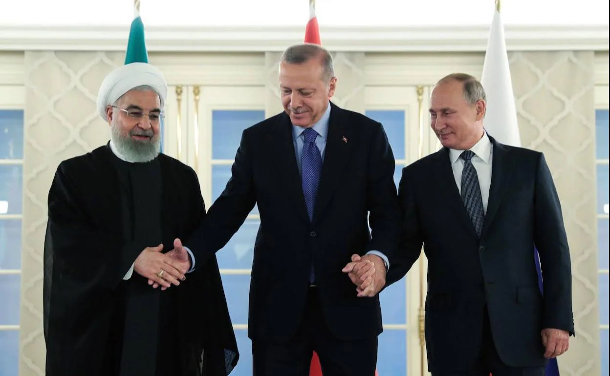 El presidente iraní, Hassan Rohani, con el turco, Recep Tayyip Erdogan y el ruso, Vladímir Putin, última vez que hablaron los dos últimos, el pasado mes de septiembre en Ankara (Turquía).