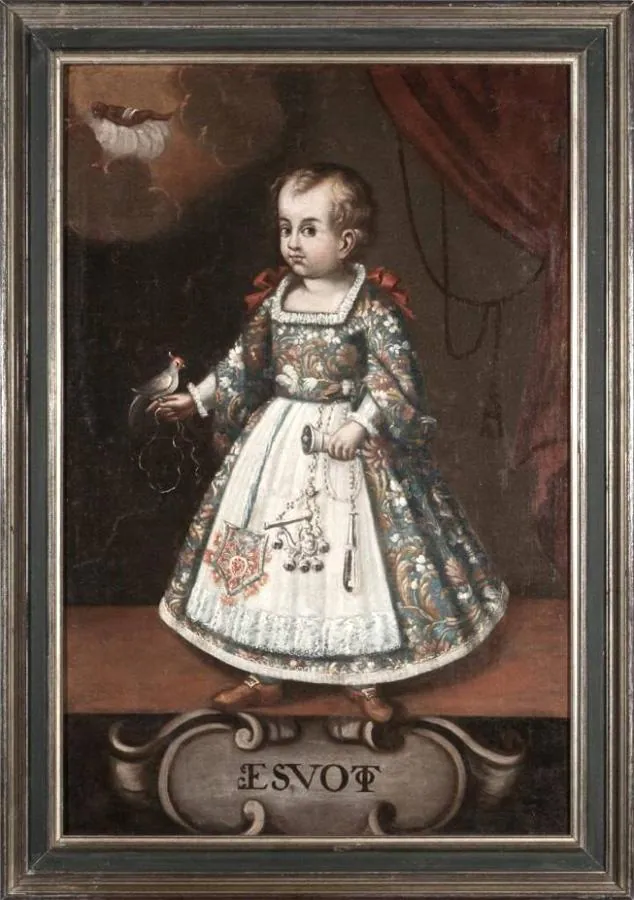 Cuadro anónimo del siglo XVII con un niño con exvotos, entre ellos un sonajero de sirena.