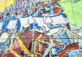 Las caras de los soldados cristianos y del rey Alfonso IX de León están picadas en el mural del paseo de la margen izquierda.
