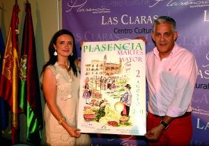 Elisa Cruz y Luis Díaz con el cartel que anuncia el Martes Mayor 2011. ::                             PALMA