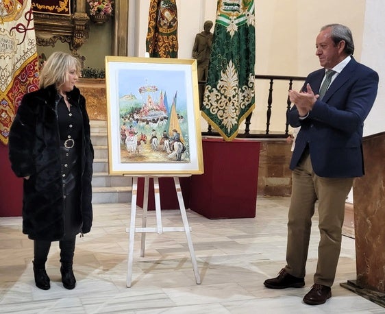 Manuela Vilches y Francisco Carmona con el cartel.