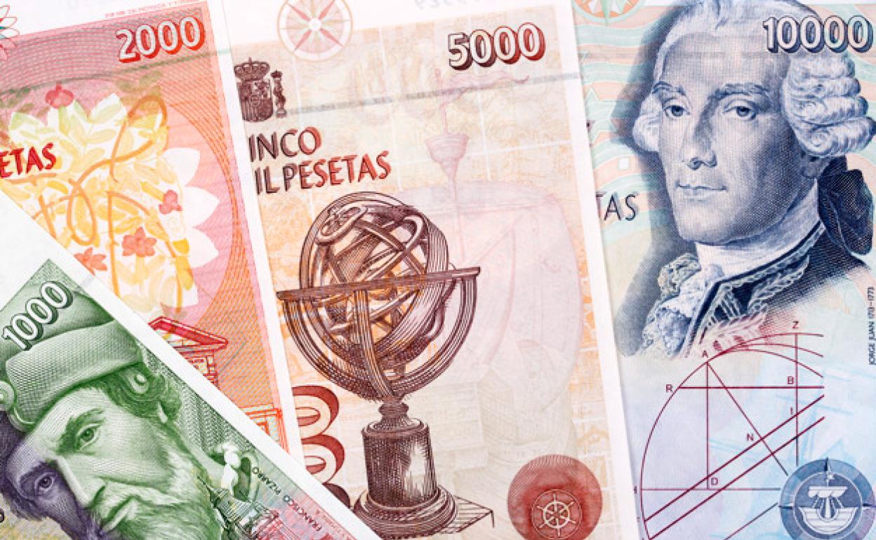 Pesetas en monedas y billetes.