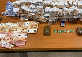 Tabaco ilegal, droga y dinero incautado por la Policía.