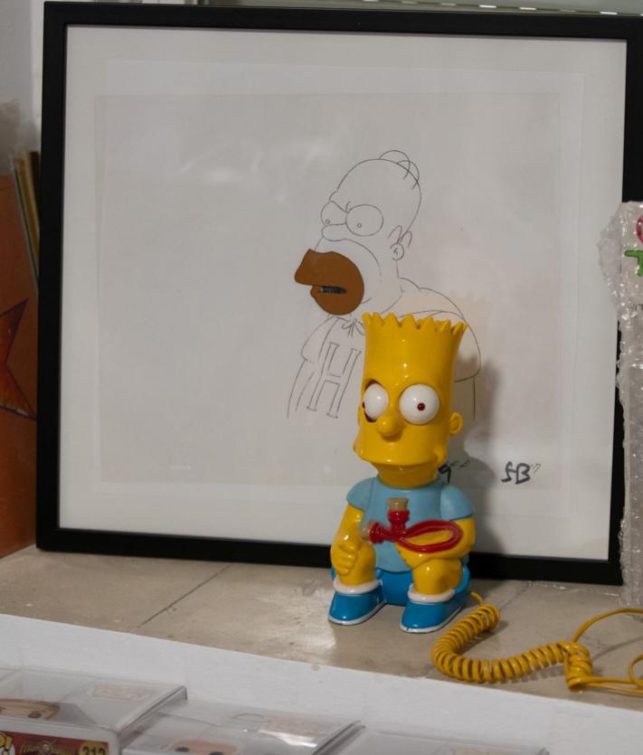 Imagen secundaria 2 - Páginas del Quijote, cómics antiguos y dibujo original de Homer Simpson. 