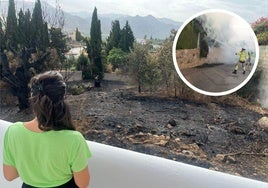 Una vecina observa el terreno quemado justo detrás de su vivienda.
