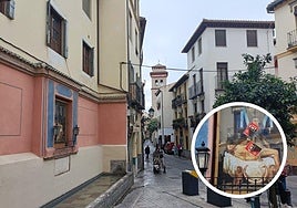 Pilar de la Virgen en calle Elvira. En el círculo, las pegatinas sobre la mampara de cristal.