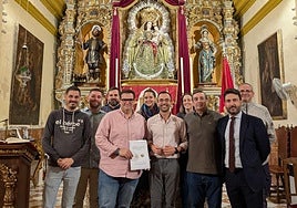 Rúbrica del acuerdo alcanzado con la hermandad de Nuestra Señora de la Granada y la Banda de Armilla