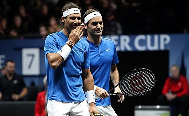 Nadal y Federer, durante el partido ante Querrey y Sock. 