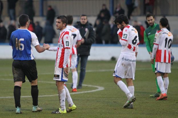 Salvador, Remón y Muneta, rotos tras el empate sufrido en Tafalla ante la Peña Sport. :: 