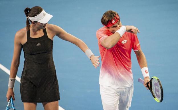 Garbiñe Muguruza y David Ferrer, durante el dobles mixto. 