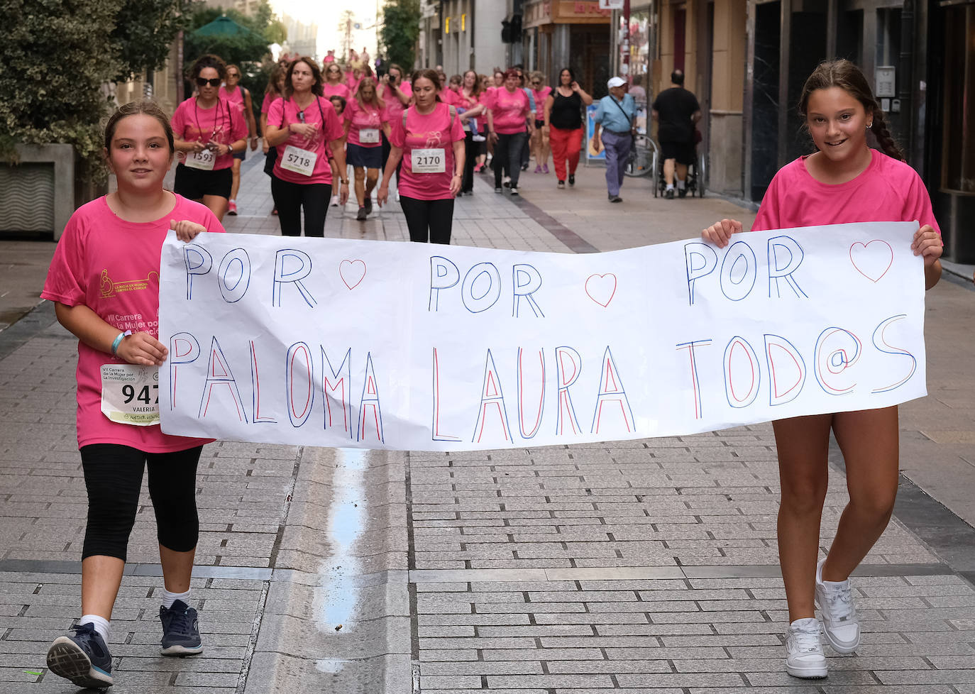 Fotos: El ambiente, los saludos y las fotos en la Carrera de la Mujer en Logroño