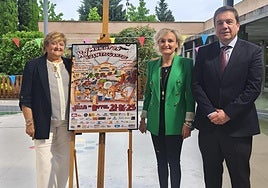 Catalina Bastida, Anabel Jiménez y Alberto Galiana, junto al cartel del XV Maratón de Cuentacuentos.