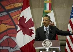Obama, durante la cumbre norteamericana de Toluca. / Afp