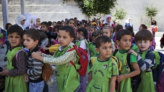 Niños sirios en un colegio de Alepo. 