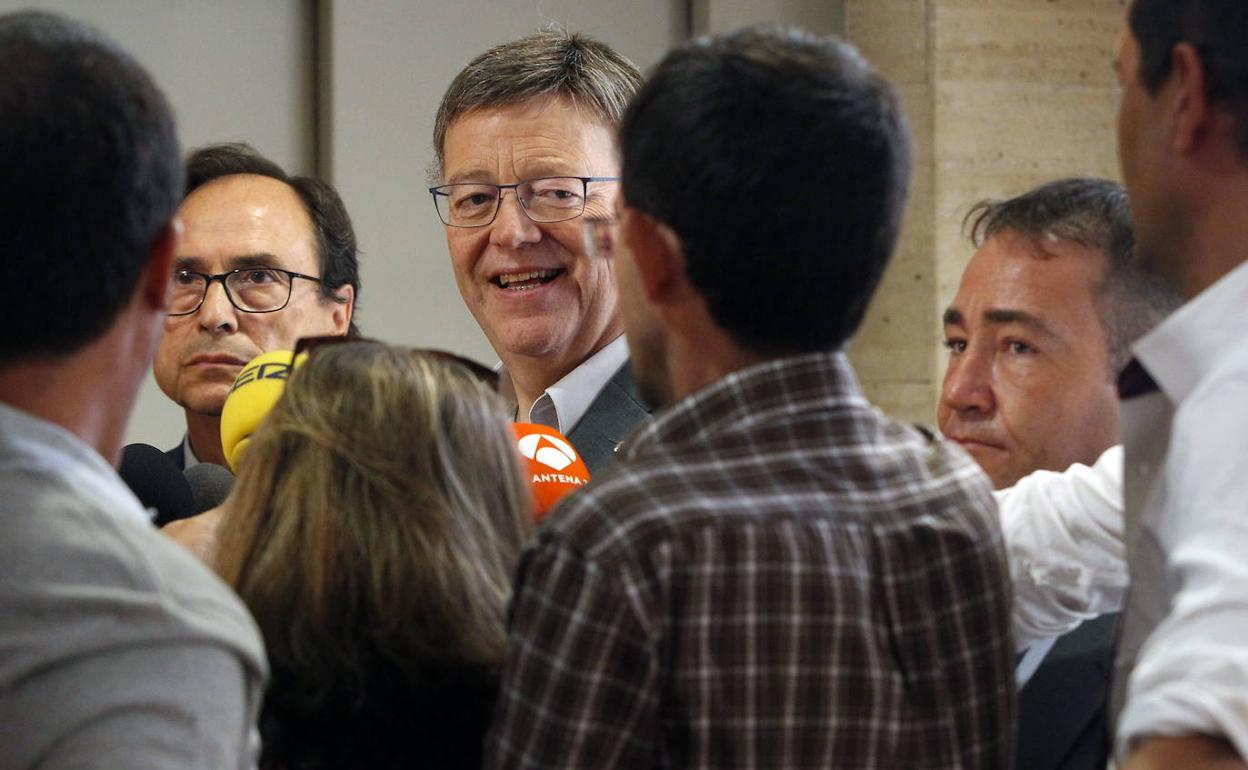 El presidente Puig, junto al director del IVF y al conseller de Hacienda 