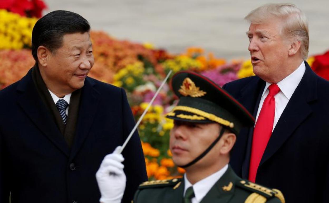 El presidente estaodunidense Donald Trump y Xi Jinping, presidente chino