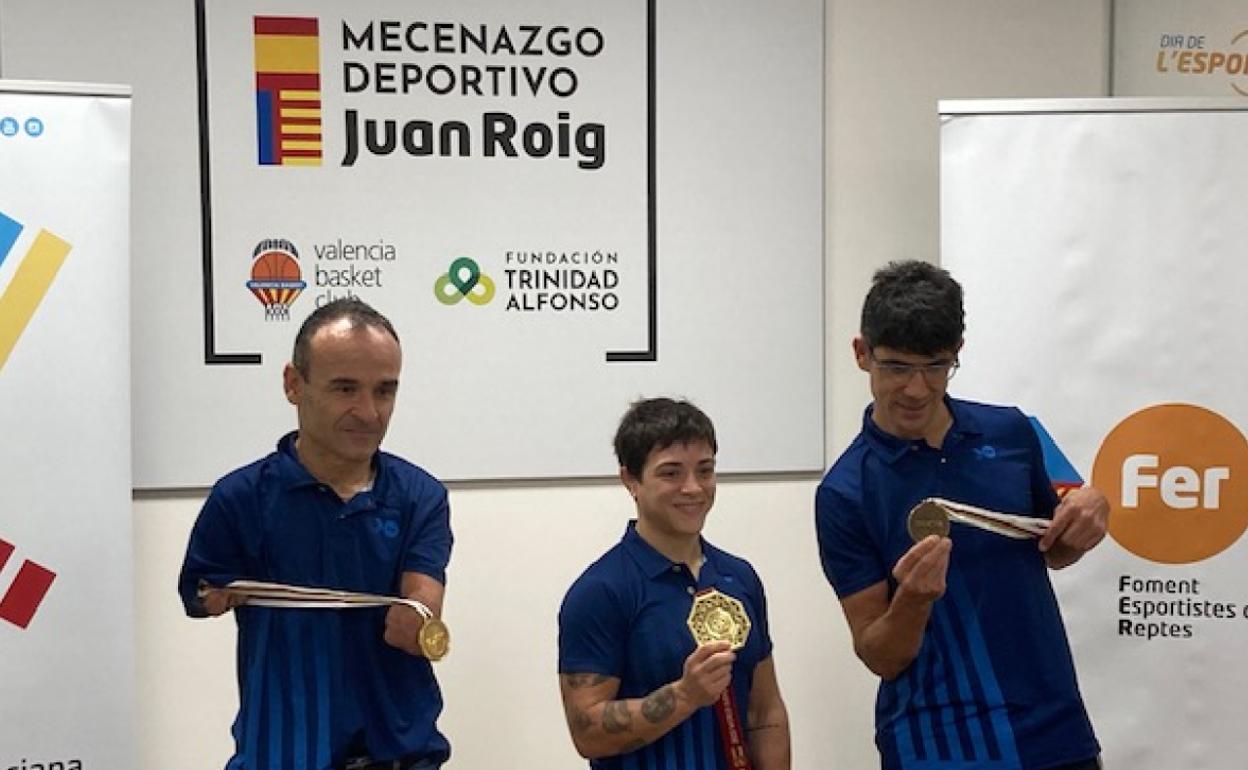 Ten, Figueroa y Eckhard, con las medallas 