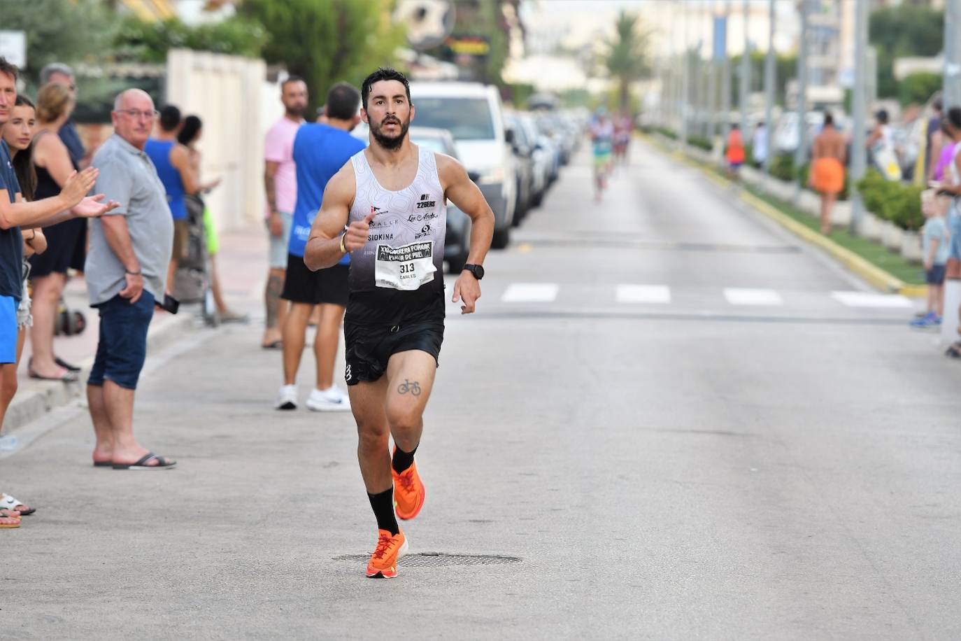 Búscate en la carrera popular Playa de Piles 2023