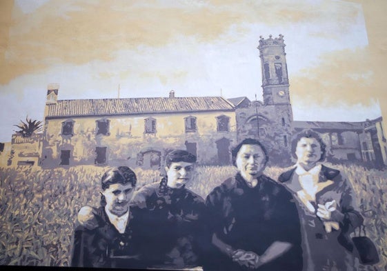 Un grupo de trabajadoras, la huerta, una alquería y el campanario de Patraix forman el mural de Roc BlackBlock.