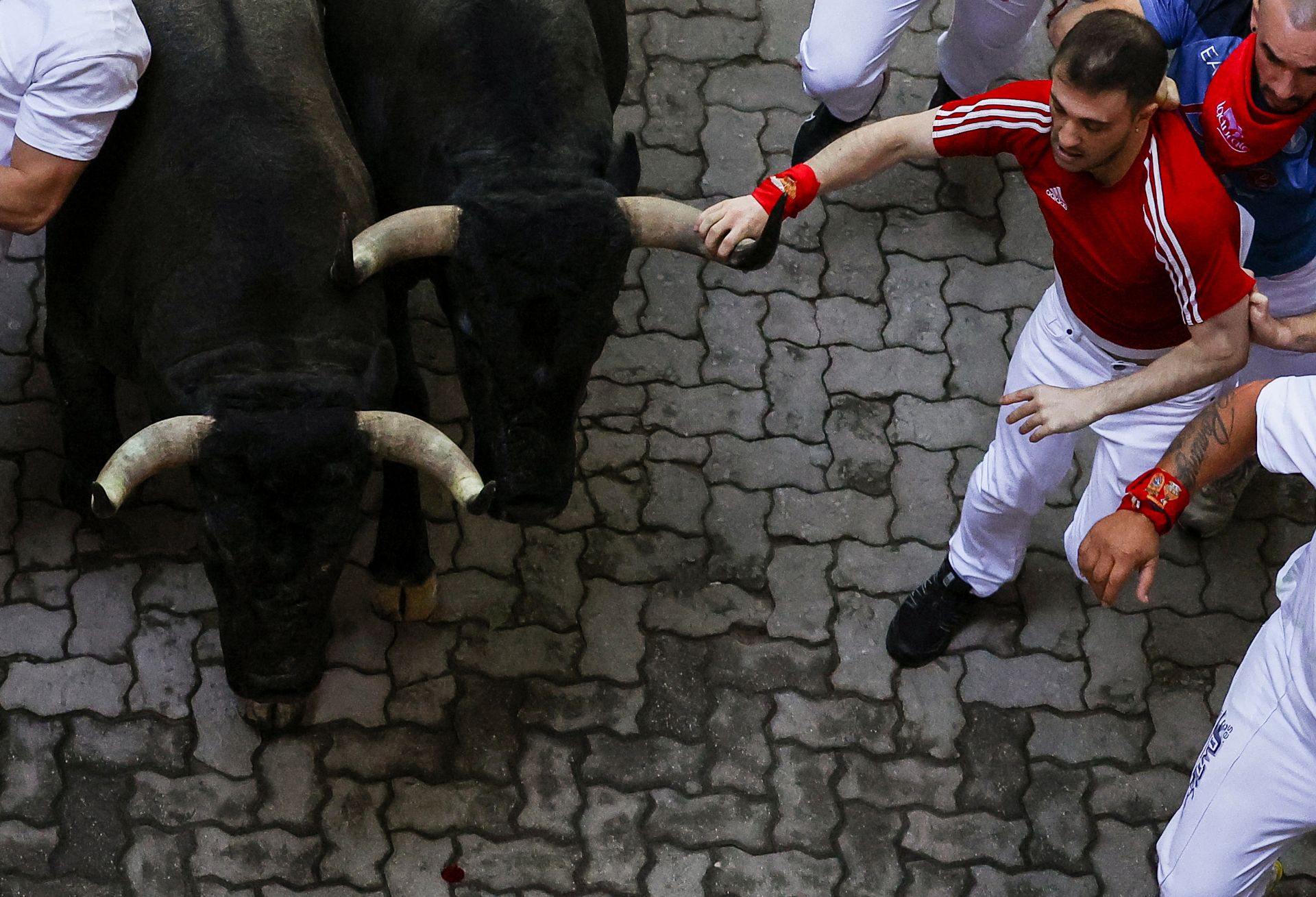 El sexto encierro de San Fermín 2025, en imágenes
