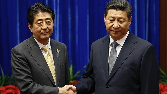 Shinzo Abe y Xi Jinping. 