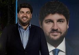 Fernando López Miras, durante la pegada de carteles.