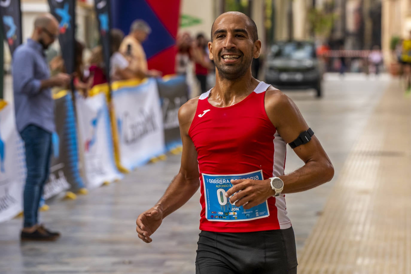 La I Carrera Solidaria Alfonso X de la Feria de Murcia, en imágenes