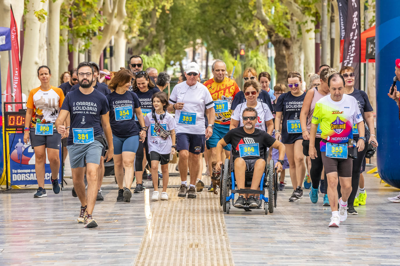 La I Carrera Solidaria Alfonso X de la Feria de Murcia, en imágenes