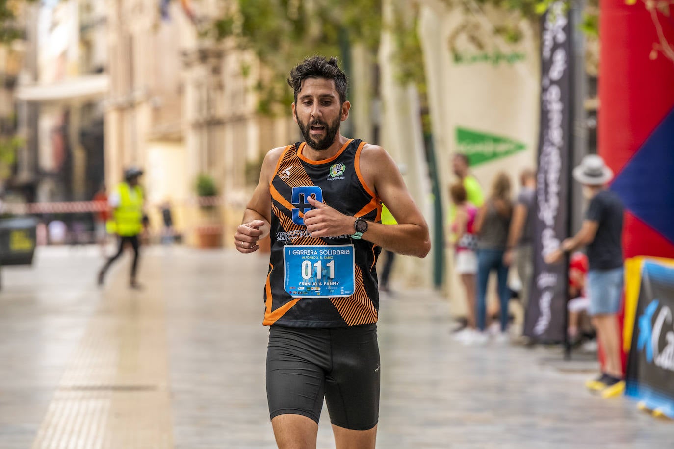 La I Carrera Solidaria Alfonso X de la Feria de Murcia, en imágenes