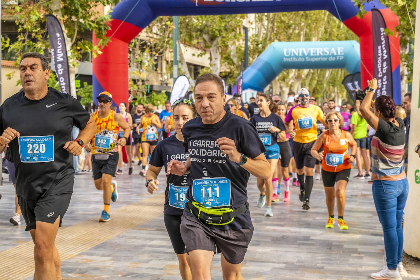 La I Carrera Solidaria Alfonso X de la Feria de Murcia, en imágenes