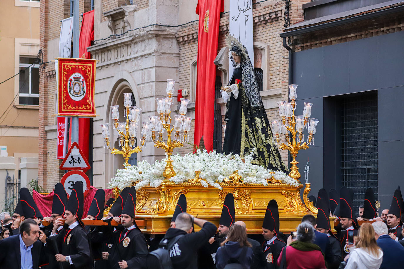 La procesión de la Soledad del Calvario de Murcia, en imágenes