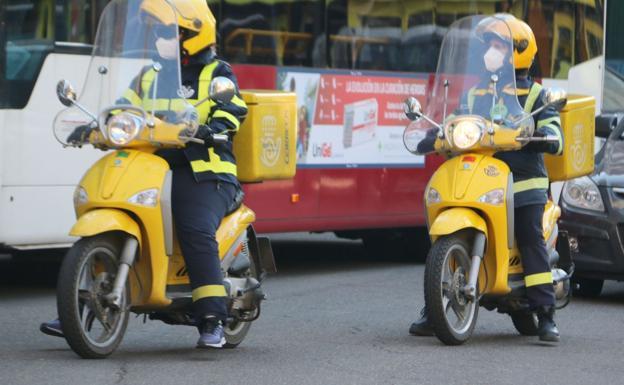 Repartidores de Correos.