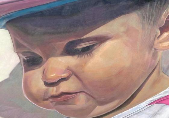 Detalle del mural de Dadospuntocero con el pequeño Álex como protagonista.