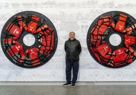 El artista chino Ai Weiwei junto a una de sus obras expuestas en el Musac.