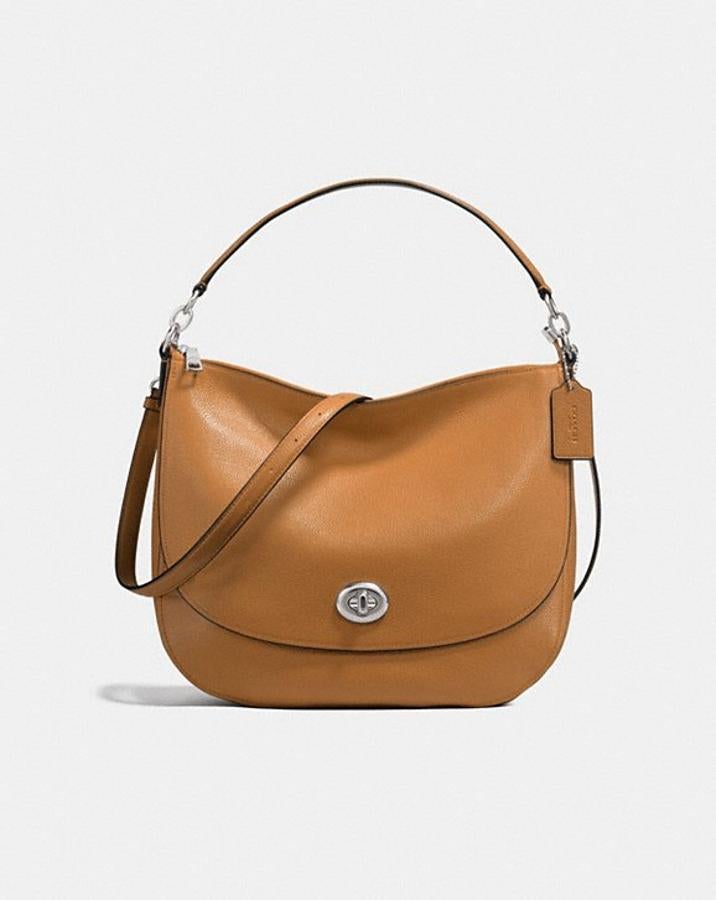 Bolso de piel color caramelo de Coach. Precio 197,50 euros (antes 395 euros).