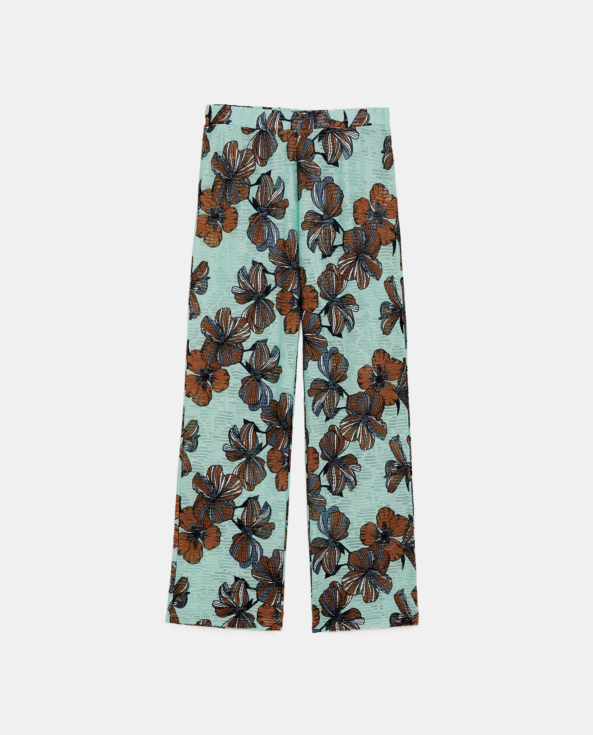 Pantalón de textura y estampado floral de Zara: 19,95 euros.