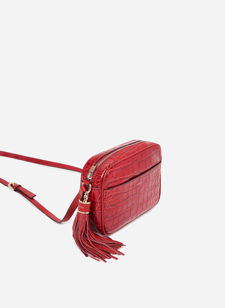 Bolso bandolera con asa regulable con detalle de piel.